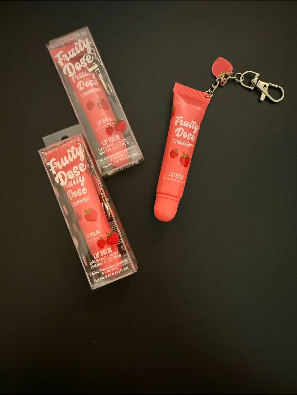 Beauty Creations Fruity Dose Strawberry Lip Balm Keychain - Coral Pink